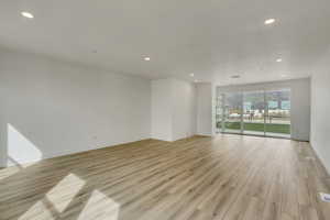 Empty room featuring light wood-type flooring