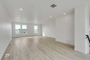 Empty room featuring light wood-type flooring