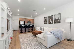 Living room with light wood-type flooring