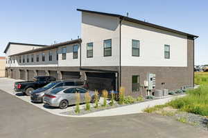 Exterior space with central air condition unit and a garage