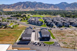 Birds eye view of property with a mountain view