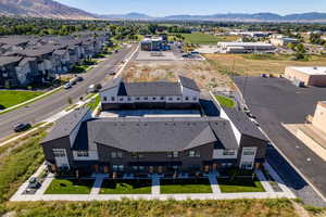 Birds eye view of property with a mountain view