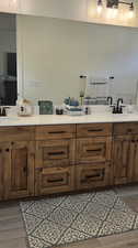 Bathroom featuring vanity and hardwood / wood-style floors