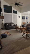 Living room featuring ceiling fan and hardwood / wood-style flooring