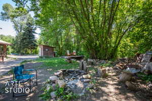 View of yard with an outdoor structure