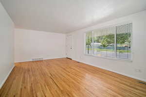 Empty room featuring light hardwood / wood-style flooring