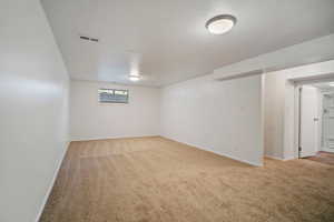 View of carpeted spare room