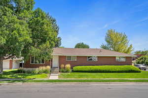 Ranch-style house with a front lawn