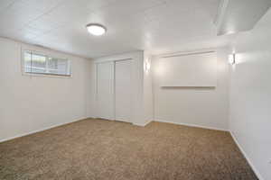 Basement with light carpet