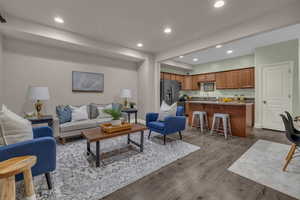 Living room with light hardwood / wood-style floors