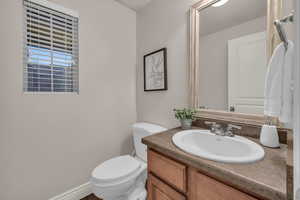 Bathroom with vanity and toilet