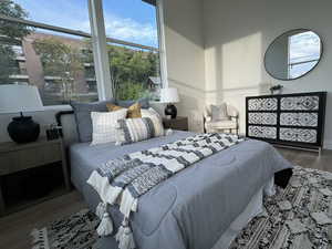 Bedroom with hardwood / wood-style floors