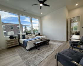 Bedroom with ceiling fan and light hardwood / wood-style flooring