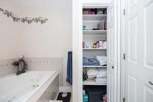 Bathroom featuring a relaxing tiled tub