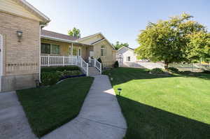 View of yard featuring a porch