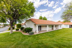 Exterior space featuring a front lawn