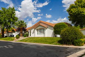 Mediterranean / spanish-style home featuring a front yard