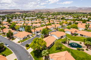 Birds eye view of property with a mountain view