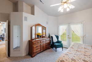 Carpeted bedroom featuring a high ceiling, ceiling fan, access to outside, and french doors