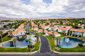 Birds eye view of property with a mountain view