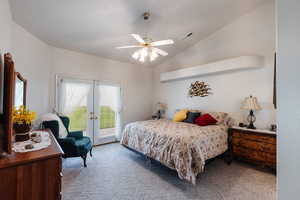 Carpeted bedroom with ceiling fan, access to outside, french doors, and lofted ceiling