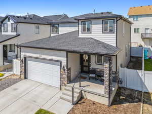 View of front facade featuring a garage