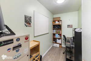 Office area featuring light hardwood / wood-style floors