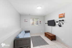 Sitting room featuring light tile patterned floors