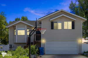 View of front of property with a garage