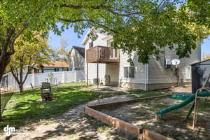 View of yard featuring an outdoor fire pit and a playground