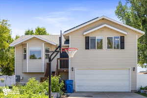 View of front of property featuring a garage