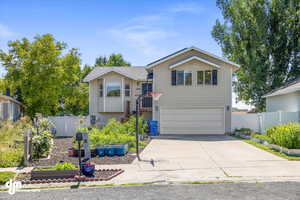 View of front facade featuring a garage