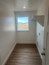 Laundry room with washer hookup, hookup for an electric dryer, and dark hardwood / wood-style floors