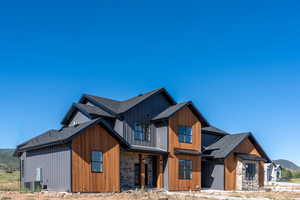 View of property exterior featuring central AC unit