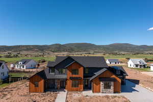 View of front of home featuring a mountain view