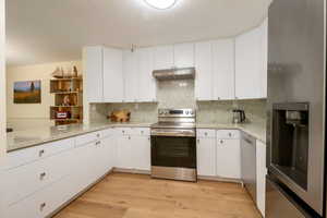 Newly renovated featuring stainless appliances and quartz countertops.