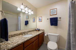 Hallway Bathroom, across from second bedroom with tub shower combination. Granite countertops.