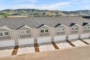 Ranch-style house featuring a mountain view and a garage