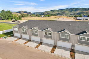 Exterior space with a garage and a mountain view