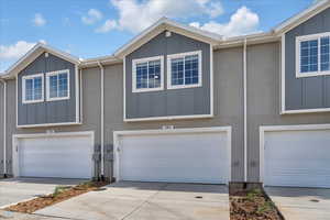 View of property with a garage