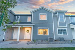 View of front of property with central AC