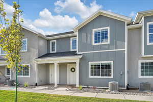 View of front of house featuring cooling unit