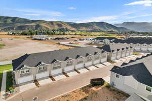 Birds eye view of property with a mountain view