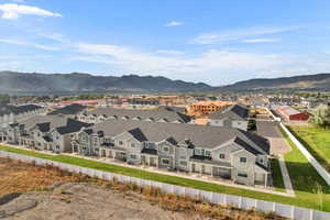 Birds eye view of property with a mountain view