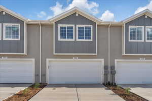 View of property with a garage