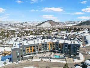 Snowy aerial view with a mountain view