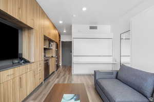 Living room with light hardwood / wood-style flooring