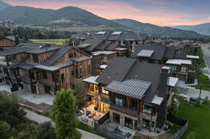 Aerial view at dusk featuring a mountain view