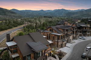 Aerial view at dusk featuring a mountain view