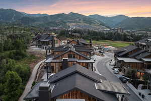 Aerial view at dusk featuring a mountain view